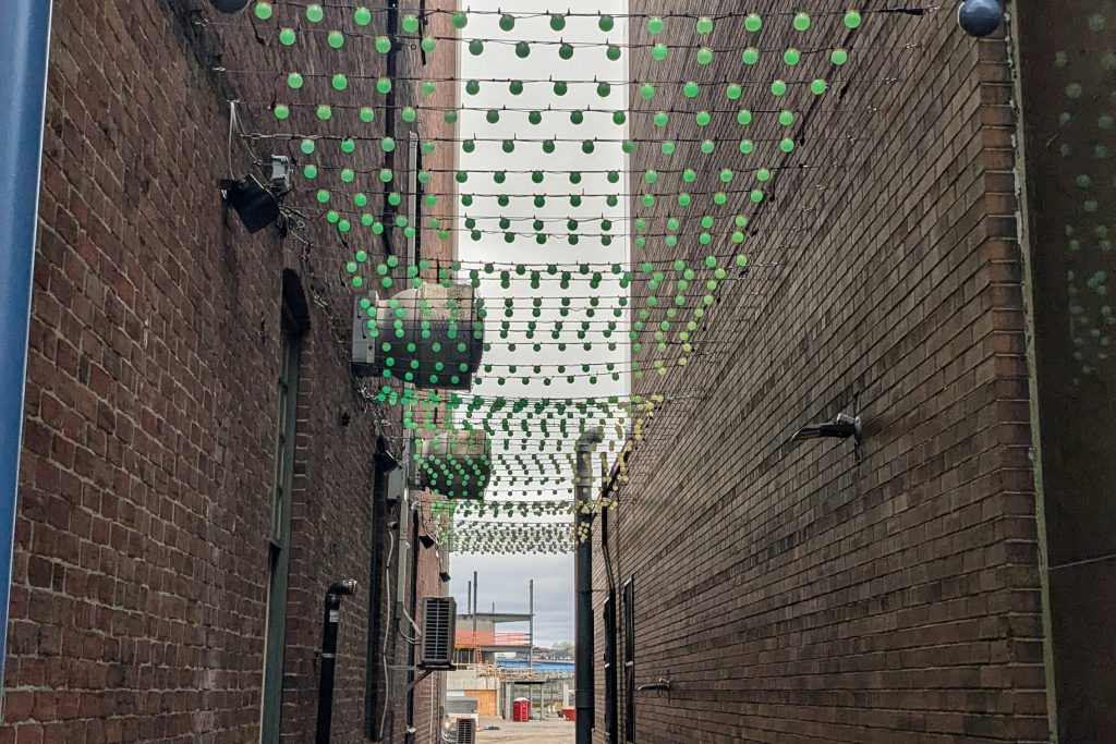 Decorative lights are strung across an alley in Uptown Saint John, NB.